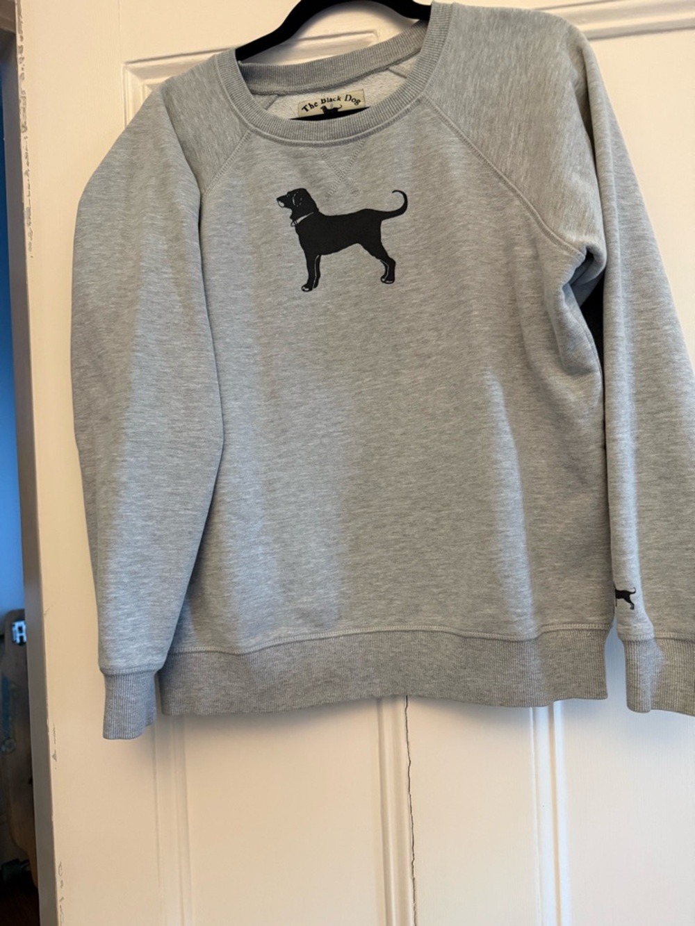 The Black Dog Cream Label with Black Dog Graphic and Red Collar